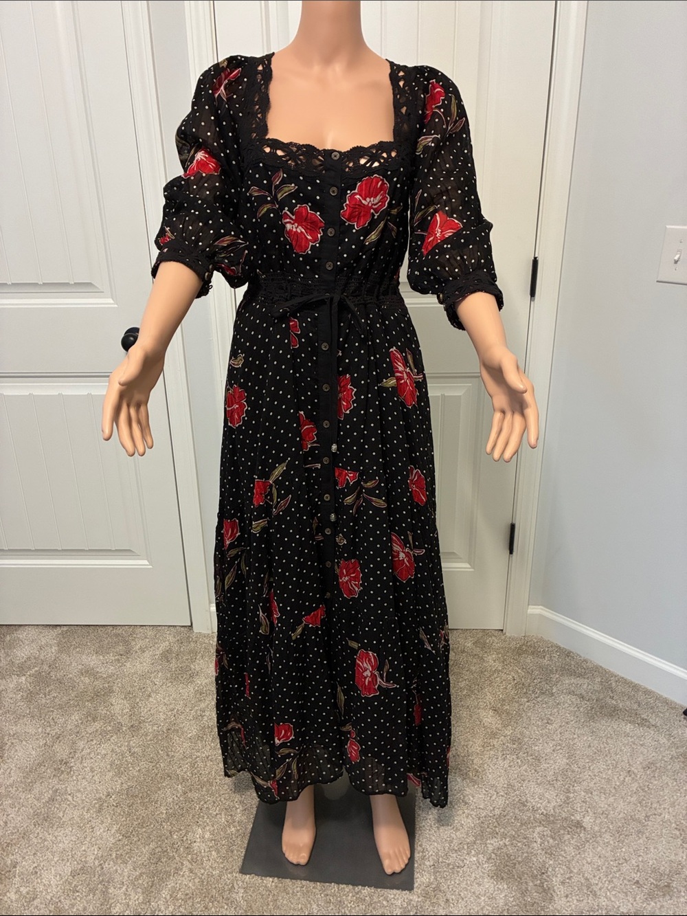 Black Floral Button-Front Maxi Dress with Puff Sleeves by Free People.